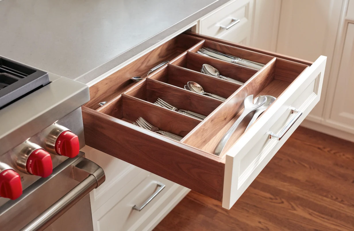 Custom wood utensil organizer inside a kitchen drawer